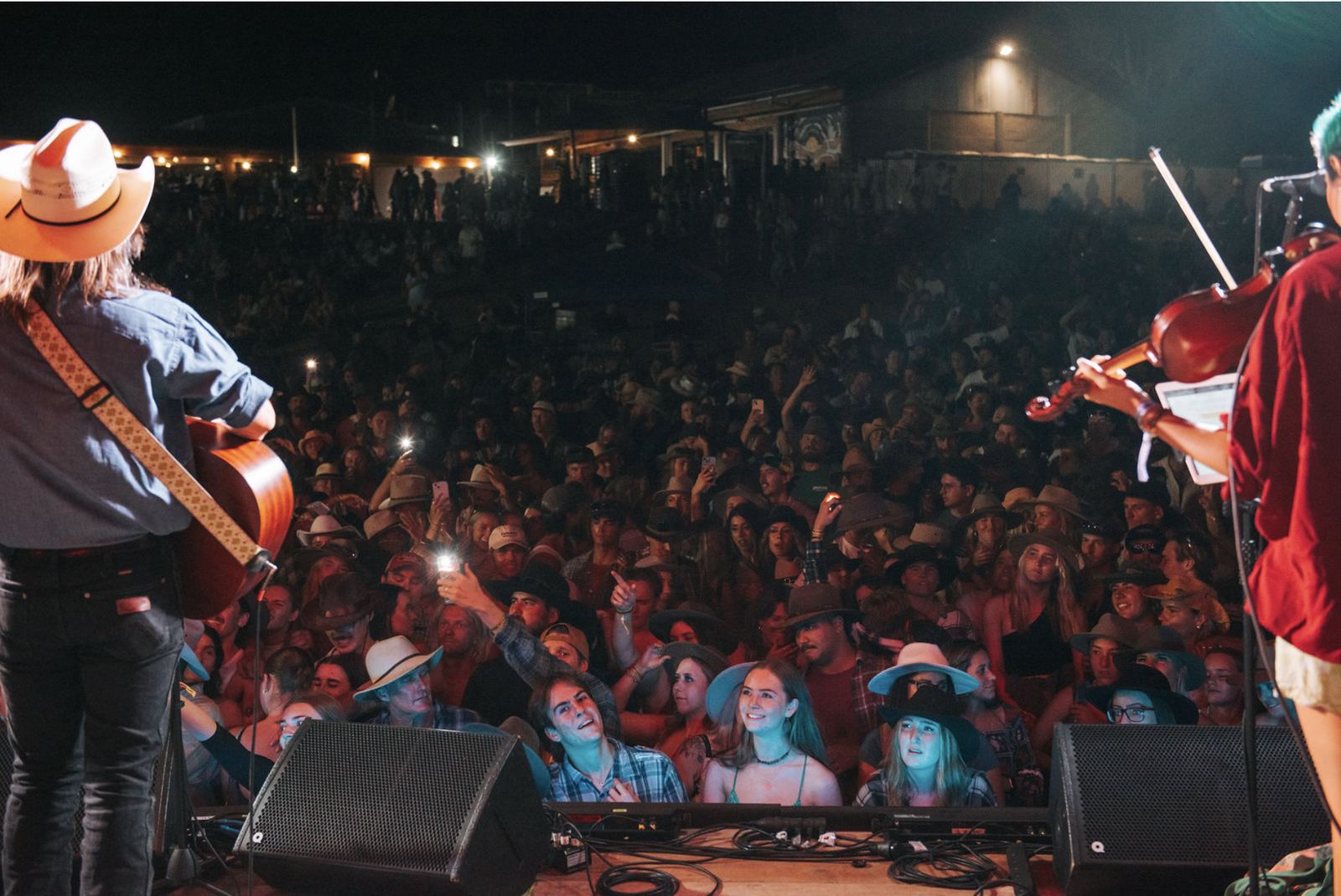 Dave Kent on stage in front of a festival crowd
